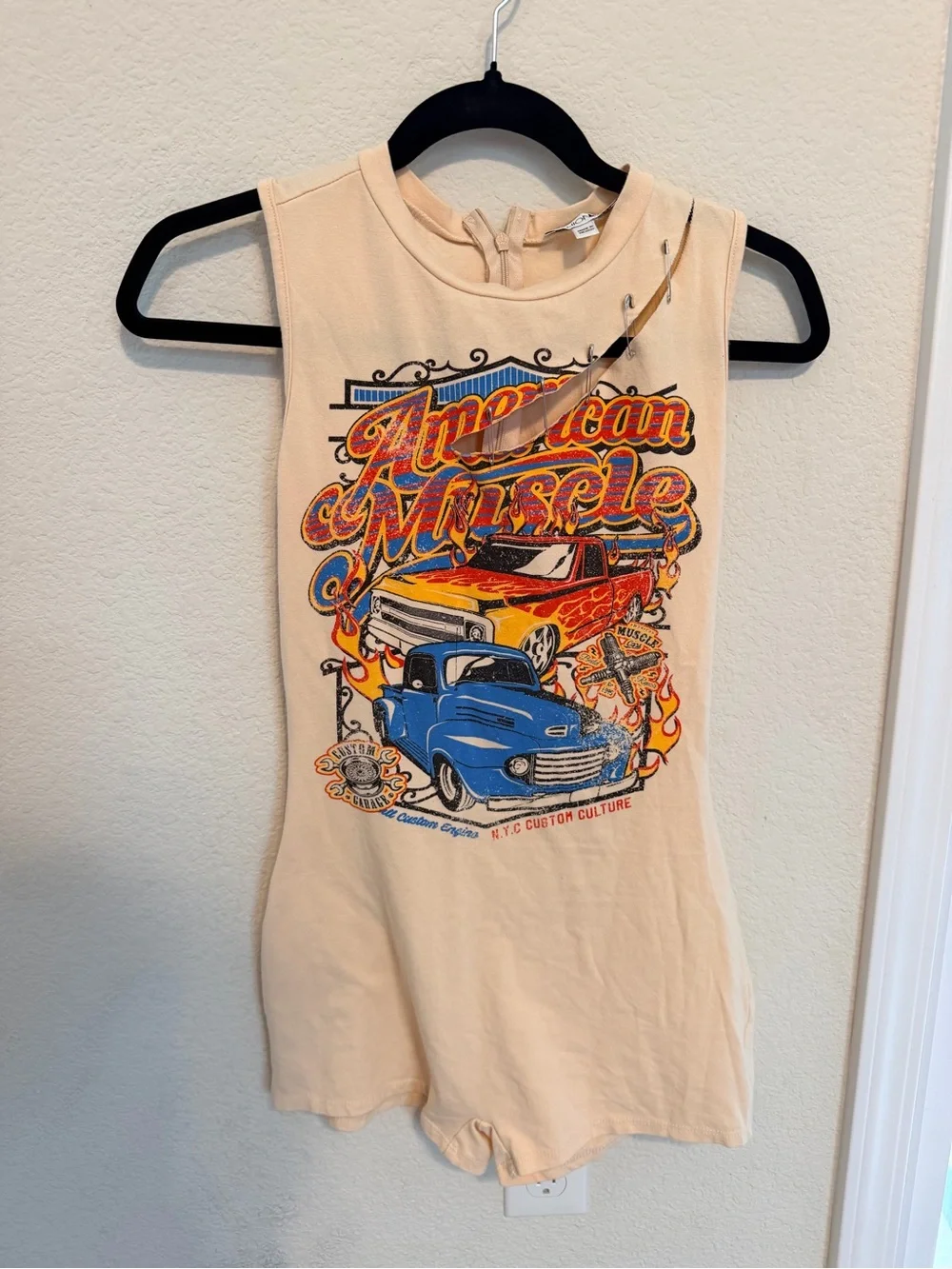 Fashion Nova Cream Graphic Muscle Car Romper with Blue & Red Print
